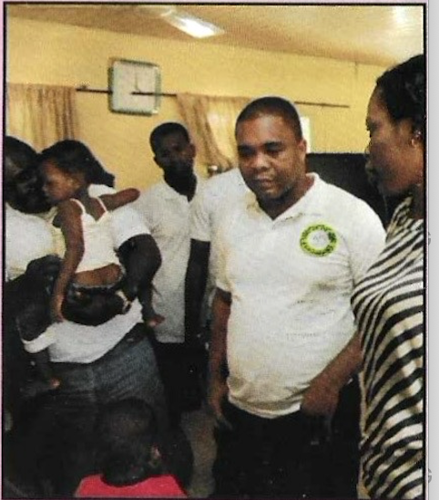 Volunteers spending time with the children