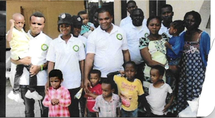 Beneficiaries and volunteers during the handover