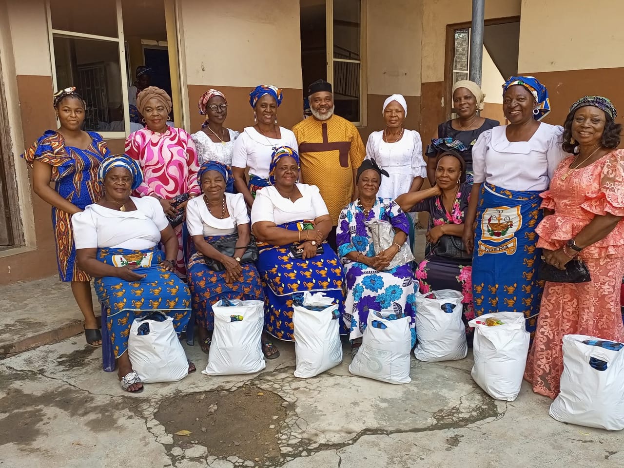Widows at St. Augustine Catholic Chaplaincy receiving donation bags