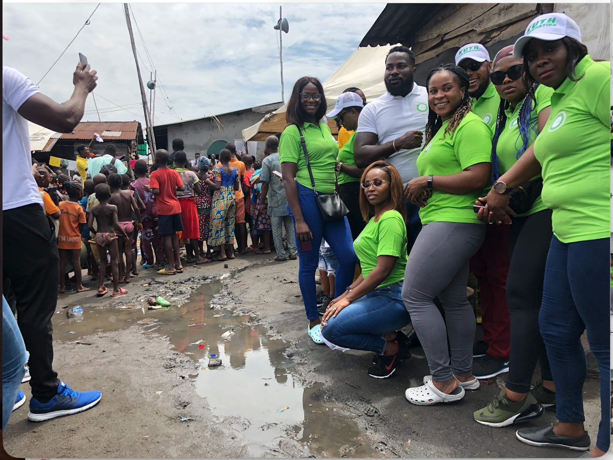 Wide shot of volunteer team with community