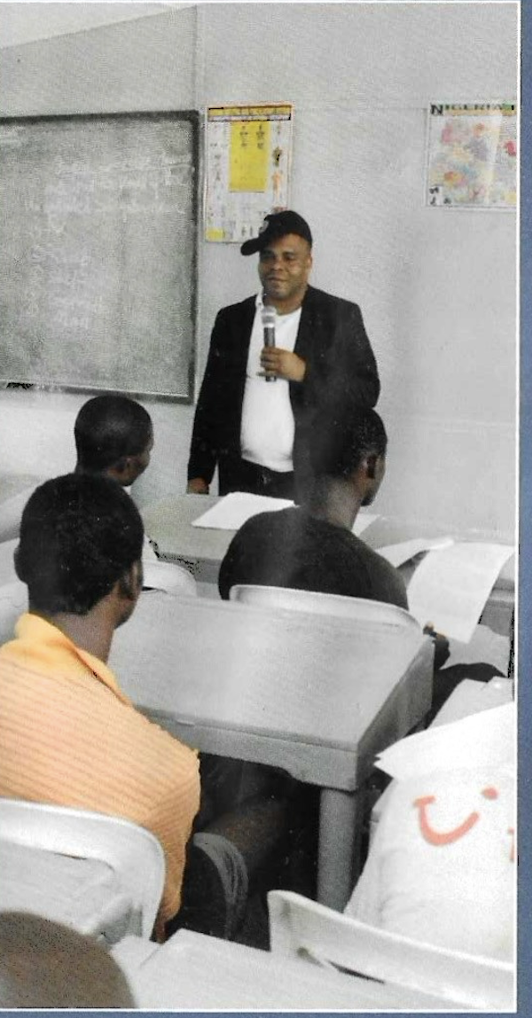 Senior Director of Programs Prince Francis Chilaka delivering a motivational talk to inmates, 2012 prison outreach