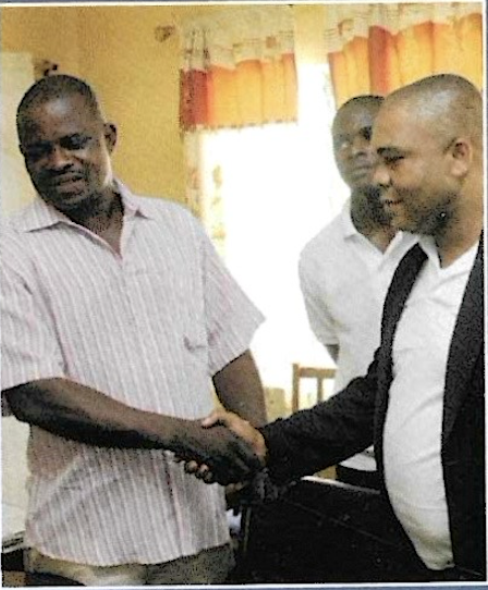 A KUTH Foundation director greeting a prison official during the 2012 prison outreach