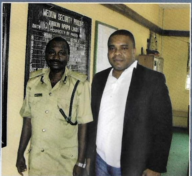 A KUTH Foundation director with a Nigerian Prisons Service officer at the Medium Security Prison, Kirikiri, Lagos, 2012