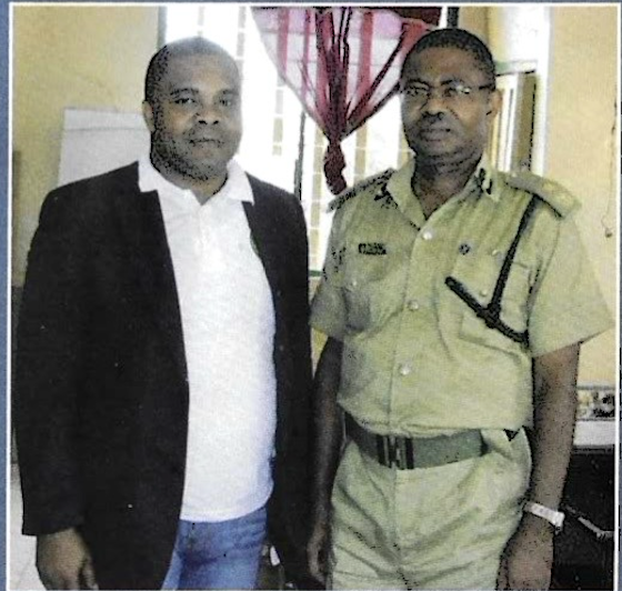 A KUTH Foundation director with a Nigerian Prisons Service officer during the 2012 prison outreach