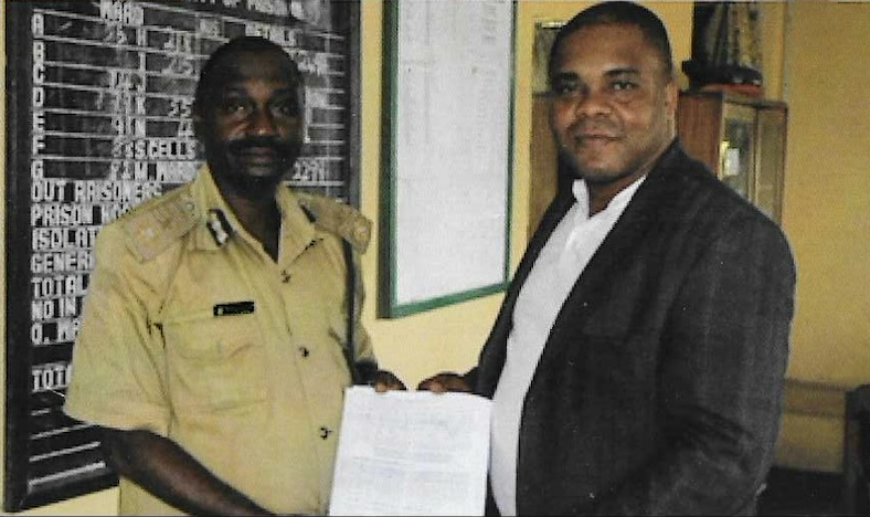 A KUTH Foundation director and a Nigerian Prisons Service officer during the 2012 prison outreach