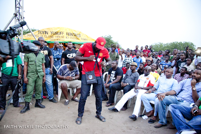 Performer interacting with seated crowd