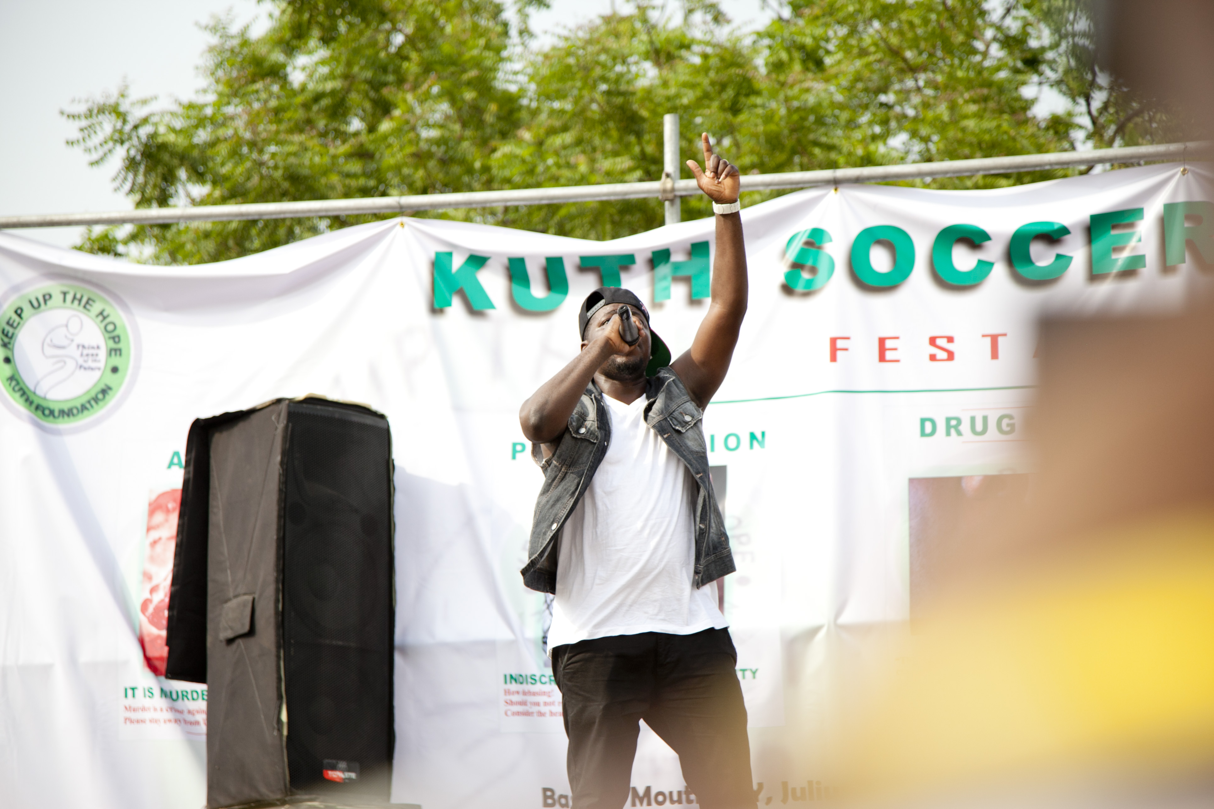 Performer on stage during daytime