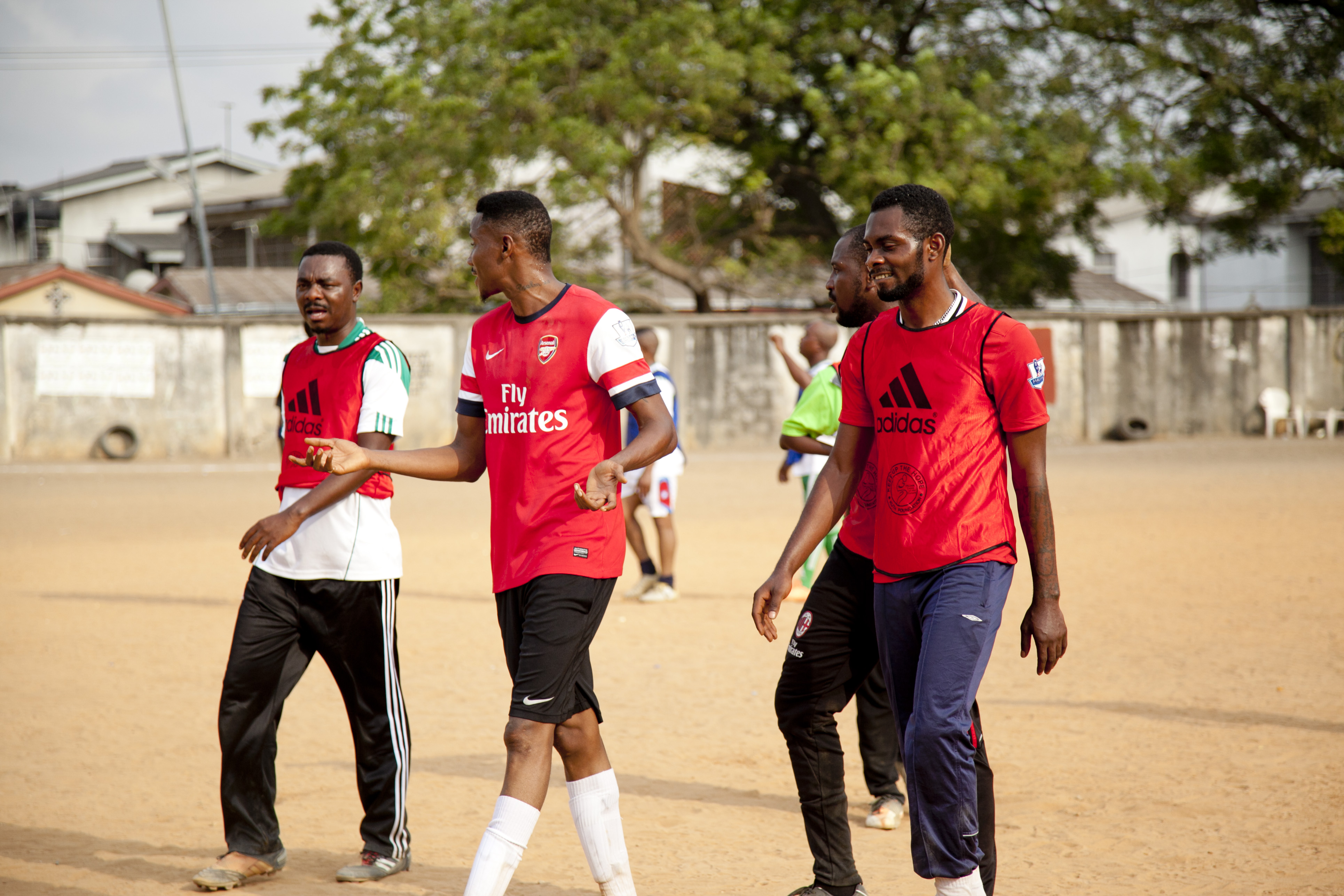 Players in red jerseys on the pitch
