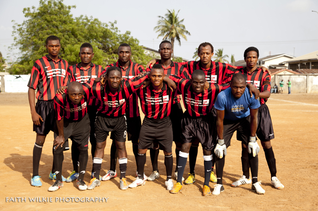 Team in red and black striped jerseys
