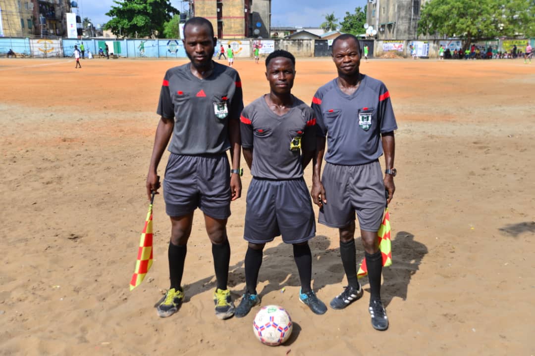 Match officials in gray