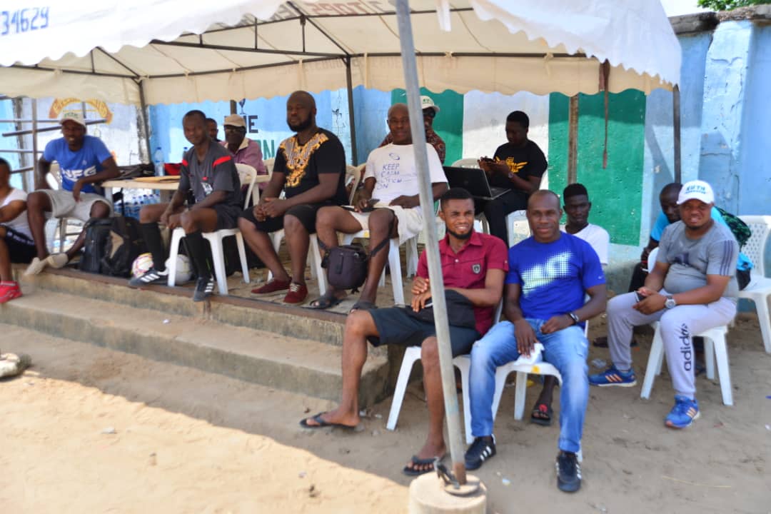 Spectators watching under tent