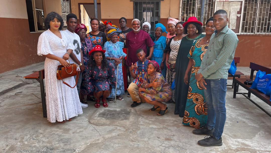 Widows and KUTH Foundation team members together at a community support gathering.
